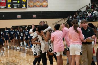 The Lady Jackets celebrate after a hard-fought win over Statesboro High.