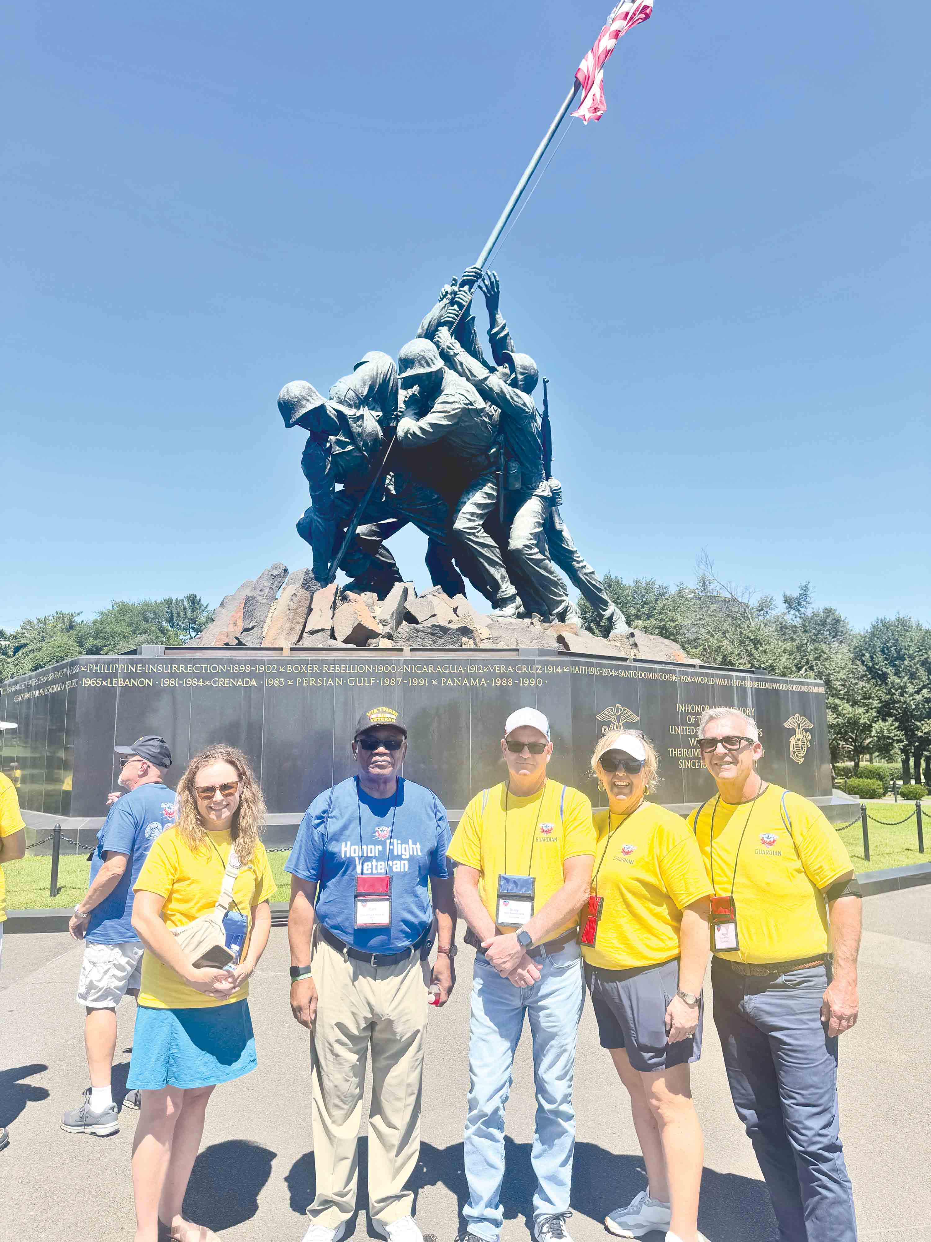 At the Marine Corps War Memorial are, from left, Heather Tyre, Cliff Davis, Danny Harris, and Jamie and Ralph Hickox.