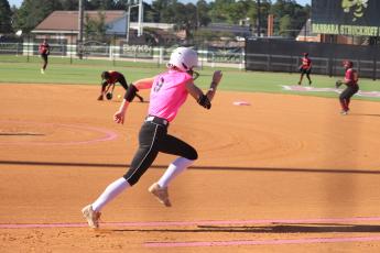 ERIC DENTY / Staff  Marlee Walling hustles to first in GHSA state play against Maynard Jackson High of Atlanta.
