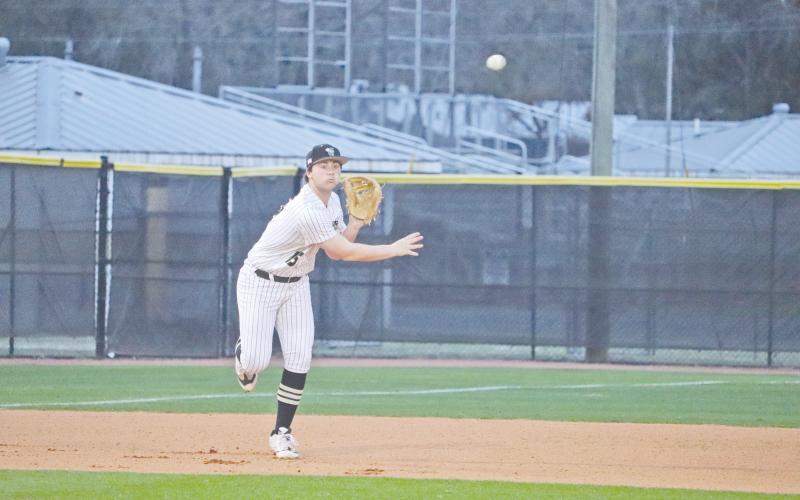 ERIC DENTY / Staff Jacket Ostin Kinard gets set at third against Pierce County High.