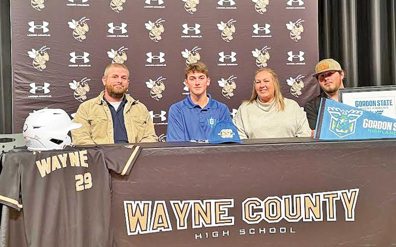 ERIC DENTY / Staff Gunner Campbell, center, recently signed to play baseball at Gordon State College in Barnesville. He is joined by his parents, Gordy and Brooke Campbell, and Carter Stewart.