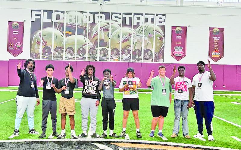 Visiting Florida universities are, from left, coach DJ West, Preston Scott, Trint Howard, Braylon McCarthur, Drae Bradwell, Ax Doomes, AJ Duncan, Zy Lewis and coach Tre Jackson.