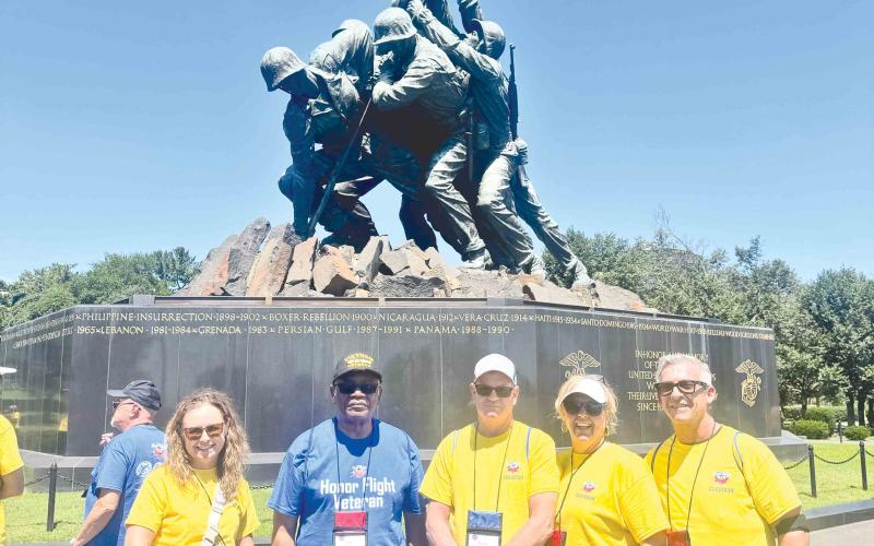 At the Marine Corps War Memorial are, from left, Heather Tyre, Cliff Davis, Danny Harris, and Jamie and Ralph Hickox.
