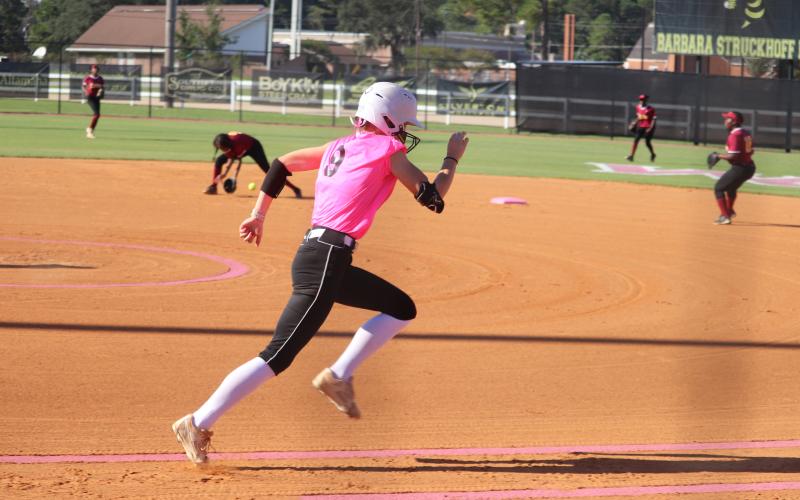 ERIC DENTY / Staff  Marlee Walling hustles to first in GHSA state play against Maynard Jackson High of Atlanta.