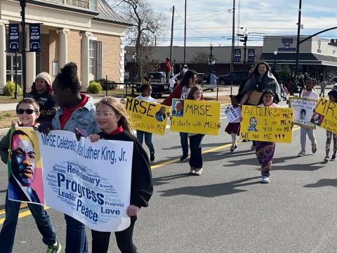 A downtown Jesup parade highlighted a full slate of weekend events celebrating Martin Luther King Jr.’s legacy. Above, students of Martha Rawls Smith Elementary proclaim the theme of the weekend, “Action: It starts with ME!”