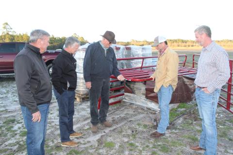 Checking out fencing material for the new county agricultural complex are, from left, Wayne County Board of Commissioners Chair Mike Gordon, County Administrator Paul Drawdy, project manager Randy Franks, Extension coordinator Mark Frye and Justin Purcell of Circle W. According to Franks, the fencing will protect both children and livestock.