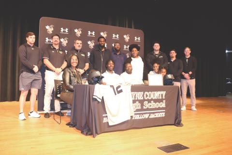 ERIC DENTY / Staff Jacket baseball player Isaiah Lee signed last week to play baseball at Andrews College in Cuthbert. He is joined by his parents, Renee Lee and Reginald Lee; his family; and the WCHS baseball coaching staff. 