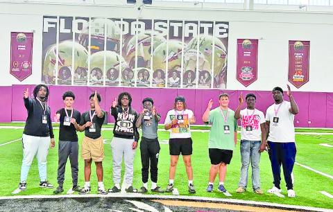 Visiting Florida universities are, from left, coach DJ West, Preston Scott, Trint Howard, Braylon McCarthur, Drae Bradwell, Ax Doomes, AJ Duncan, Zy Lewis and coach Tre Jackson.