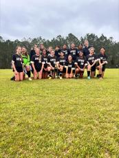 The AWMS girls soccer team won the 2024 Southeast Georgia Middle School Conference title on Monday over Long Middle 4-0. Members of the team include, front row, from left, Emma Mock, Isla Harris, Kendall Horne, Hailey Warren, Bella Brown, Chelsie Balbino, Jayden McCann, Angie Moreno, Lexi Little and Petra Montpetit and, back row, from left, head coach Hannah Fennel, Gracie Wingate, Halle Harrison, Synthia Lin, Vania Cruz-Mendez, Gabby Rojas, Allison Aguilar and assistant coach Nicole Wingate.