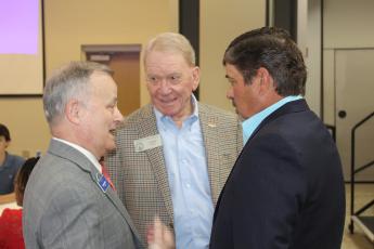 From left, Coastal Pines Technical College President Lonnie Roberts chats with State Reps. Buddy DeLoach and Steven Meeks just before the Post Legislative Luncheon Tuesday.