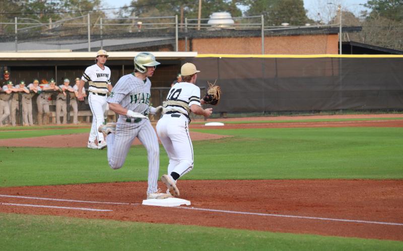 Jacket first baseman Carson Shaver secures the throw for an out.